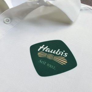 In logo lên áo đồng phục Haubis