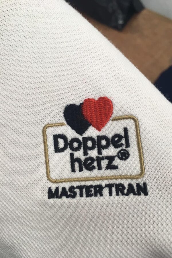 Thêu logo áo đồng phục Master Trần