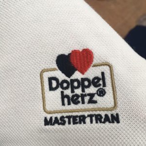Thêu logo áo đồng phục Master Trần