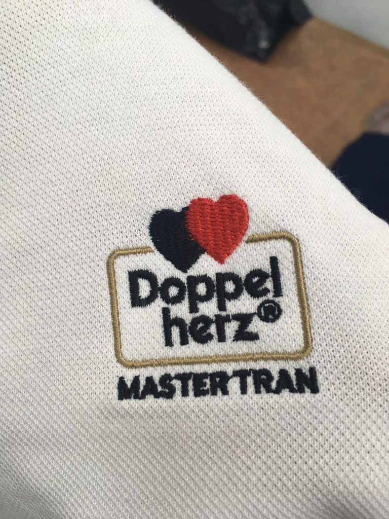 Thêu logo áo đồng phục Master Trần