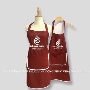 Tạp dề salon tóc Lợi Nguyễn đỏ đô viền trắng